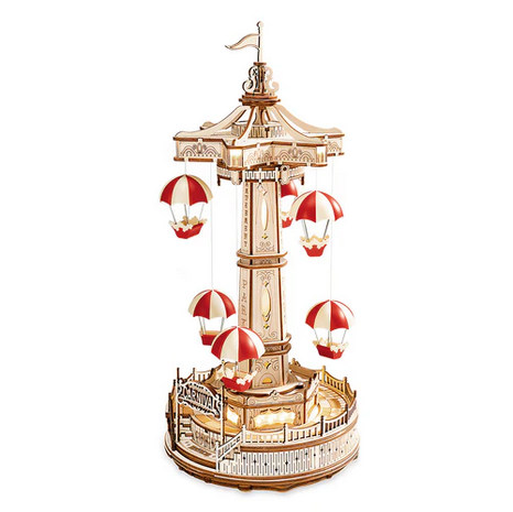 Model of a carousel with red and white striped carousels on a white background