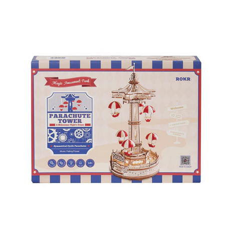 Boxed model kit of a parachute tower with colorful design elements on a white background